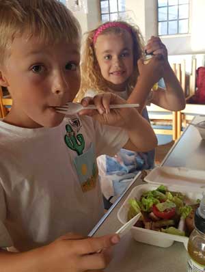 Children enjoy Summer kitchen meals at St Christopher's.